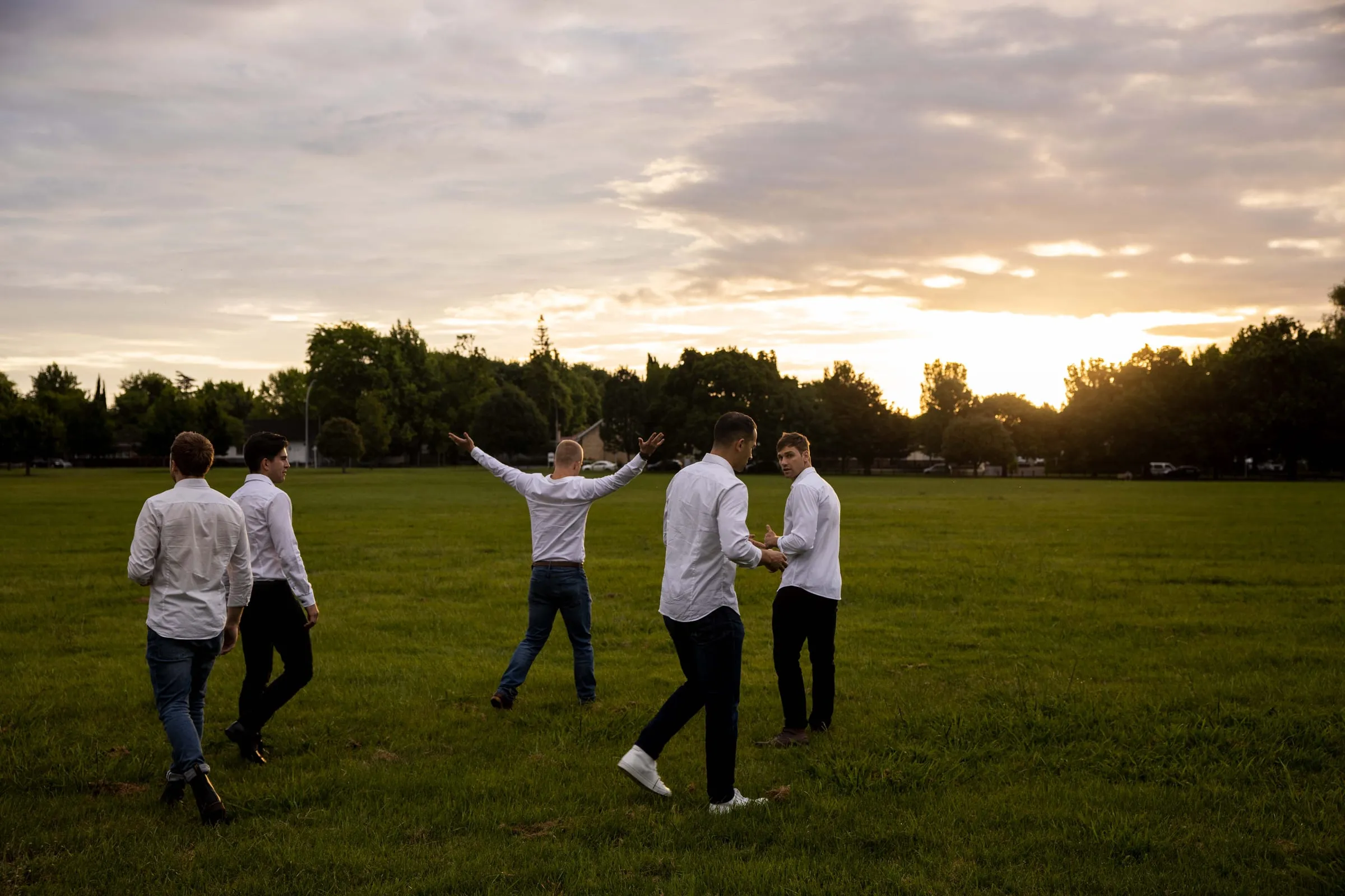 The Flourish team walking together across a park at sunset
