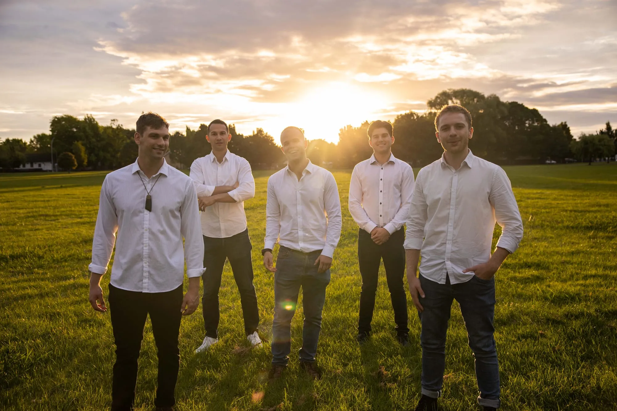 The Flourish team standing together in a park at sunset