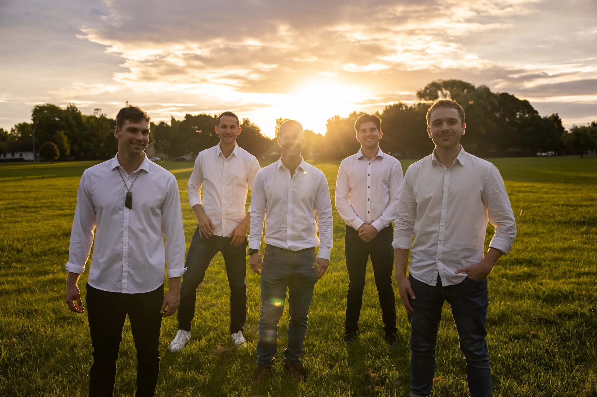 The Flourish team standing together in a park at sunset